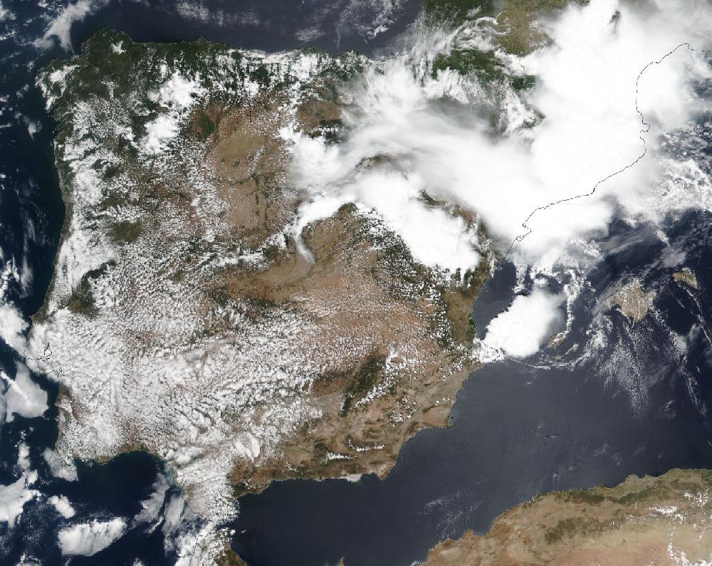 True-colour satellite image of the Iberian Peninsula and the Balearic Islands on 12 July 2025